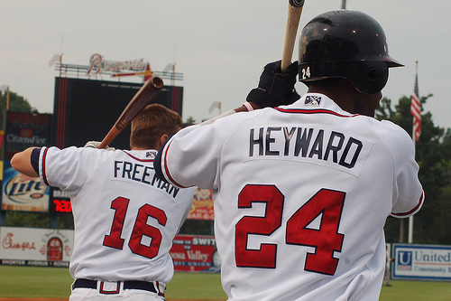 Atlanta Braves' Jason Heyward (R) gets a hug from teammate Freddie